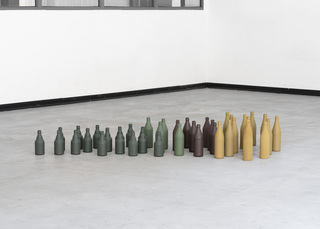 The pack (das Rudel), 2023, paint on glass bottles, 170 x 75 x 26 cm