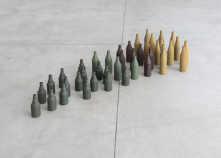 The pack (das Rudel), 2023, paint on glass bottles, 170 x 75 x 26 cm